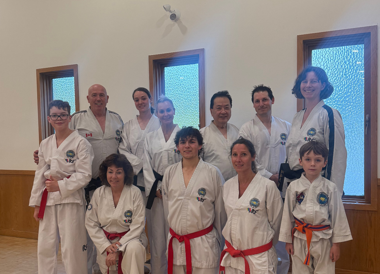 Impact Martial Arts students and instructors together in the dojang