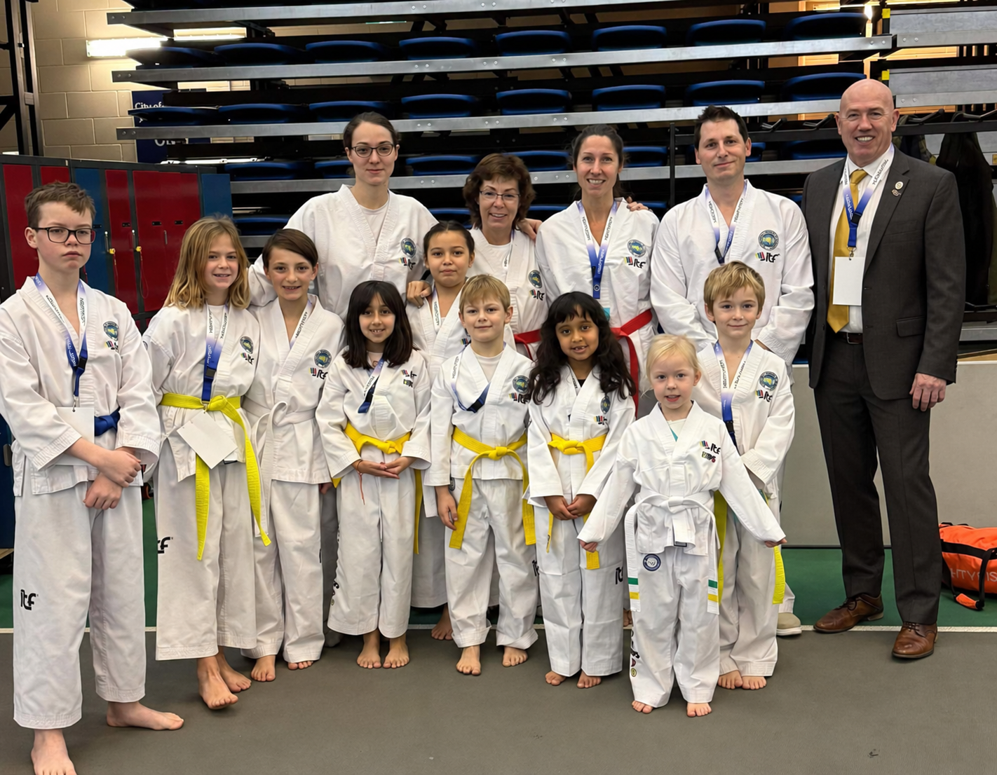 Impact Martial Arts students and instructors together at a community event